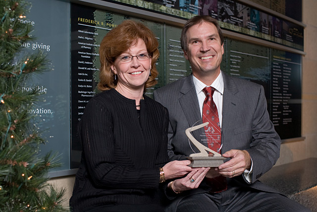 Kathleen Skibinksi, 2008 Alumna of the Year, is congratulated by Phil Berce, PAA immediate past president.