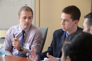 Lucas Fass (left) listens to peers in a discussion at the MCLC 2015 Conference at West Point, NY.