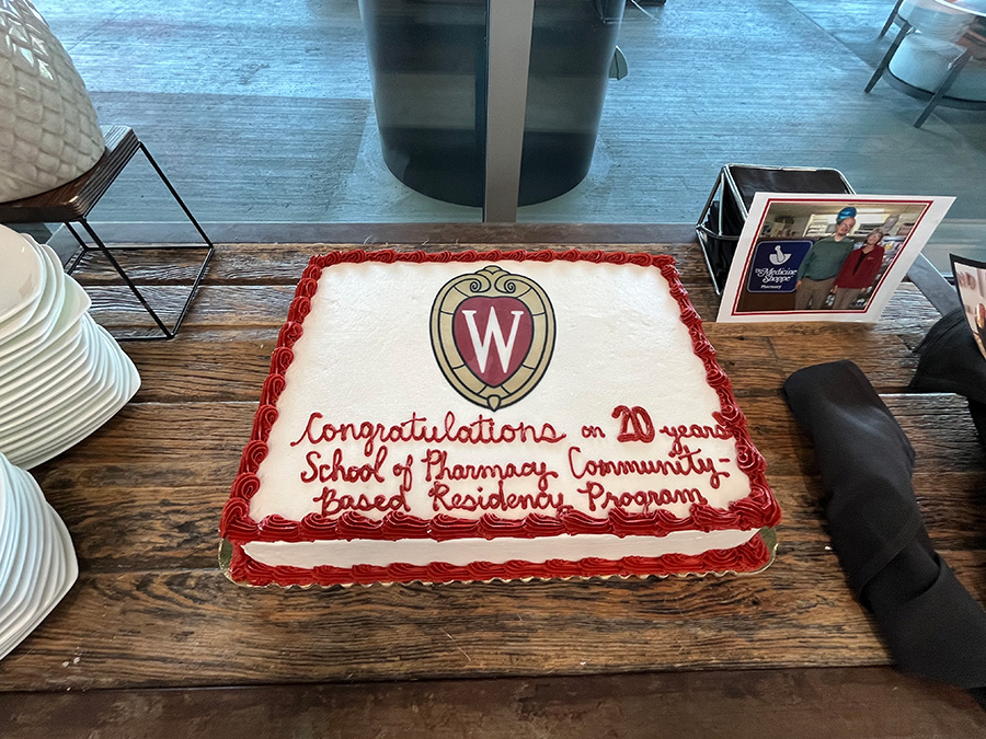20th Community Residency Program Anniversary cake with large W shield decoration