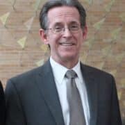 headshot of John Swann, SAS alumni