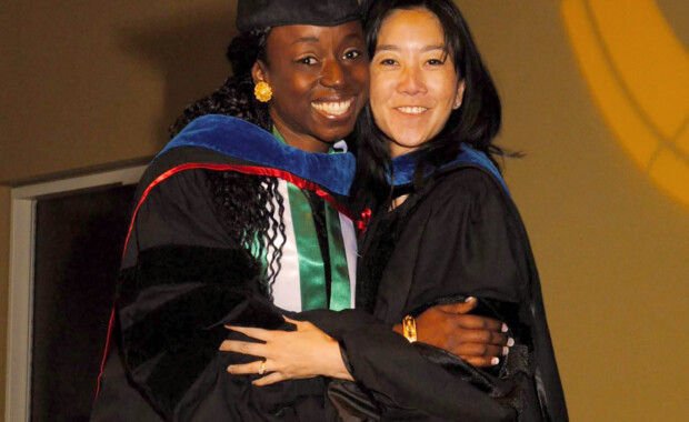 Michelle Chui hugging a graduated Dr. Olufunmilola Abraham