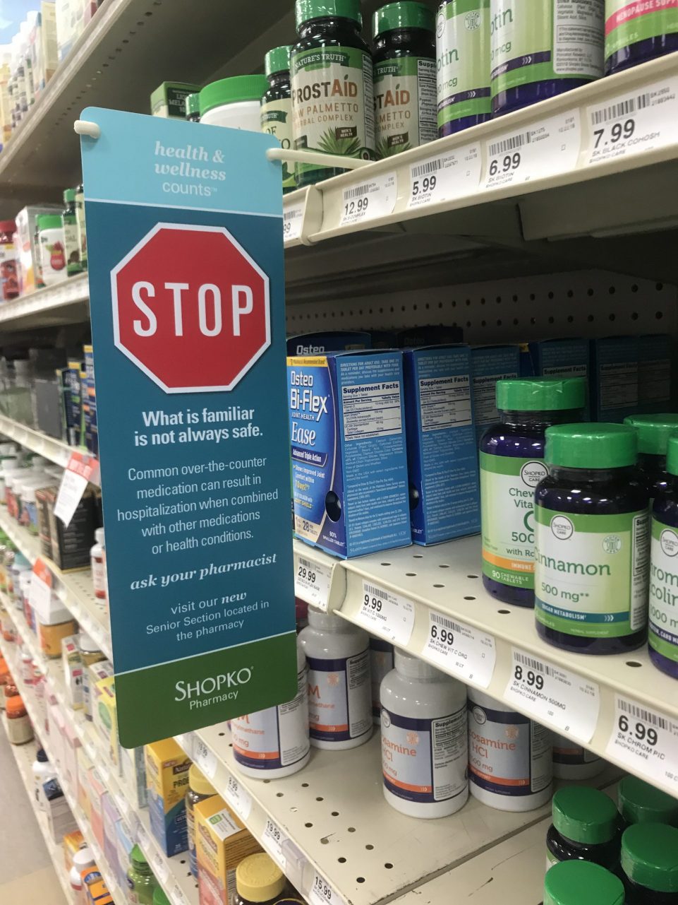 Small warning banner on medication shelf in Shopko Pharmacy