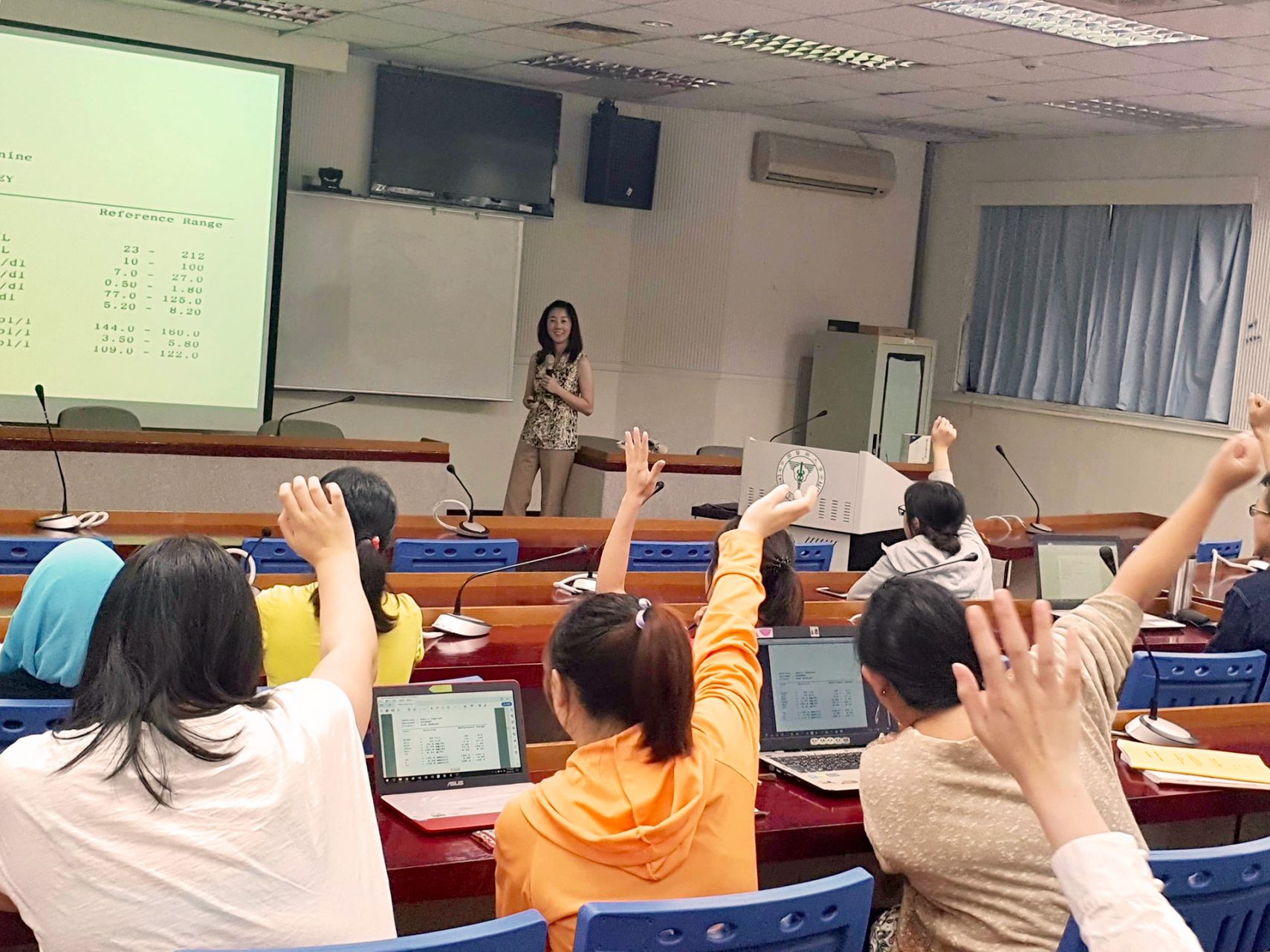 Michelle Chui teaching a classroom