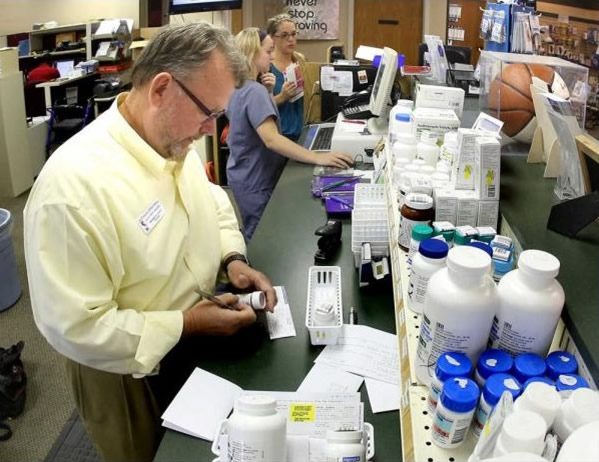 Pharmacists working at counter