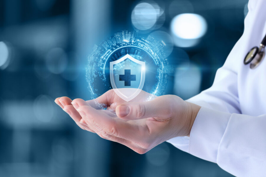 doctor with cupped hands and icon of healthcare system floating above