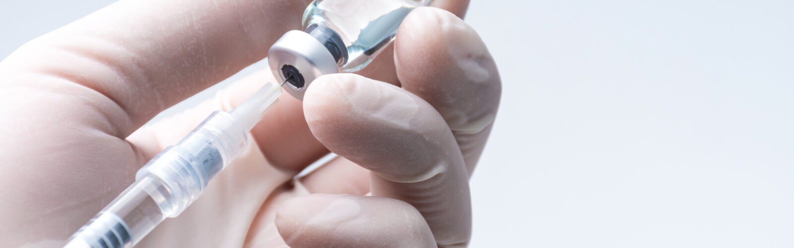needle in vial preparing for injection