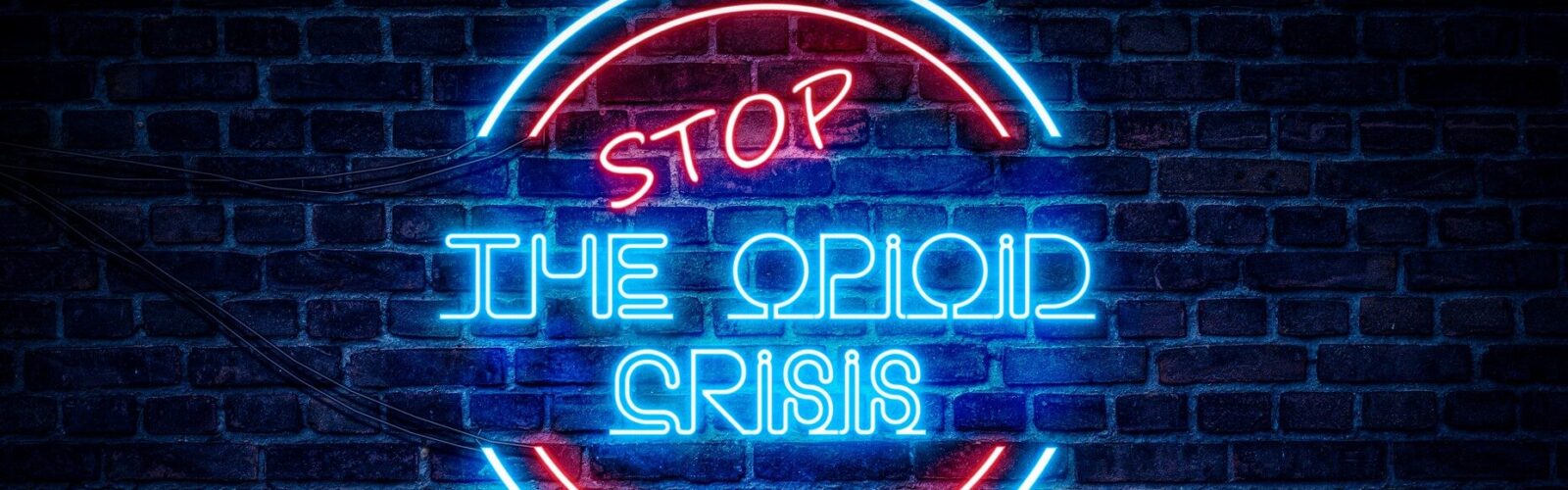 neon sign saying Stop the Opioid crisis