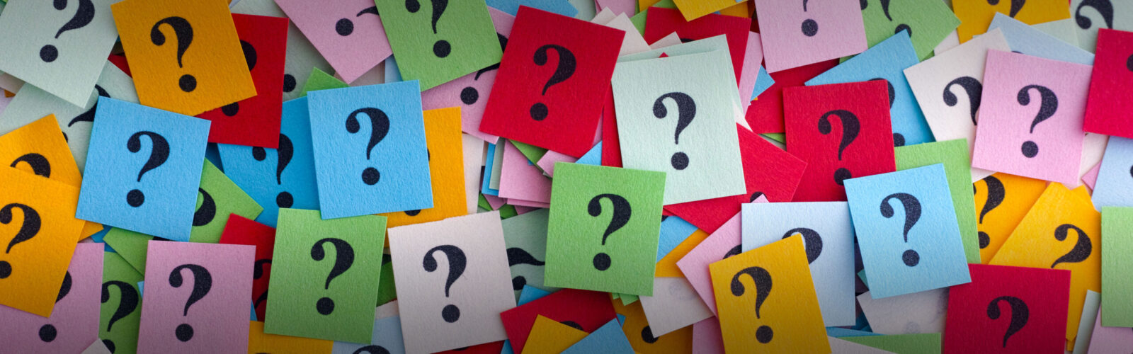 colorful squares of paper with a ? mark