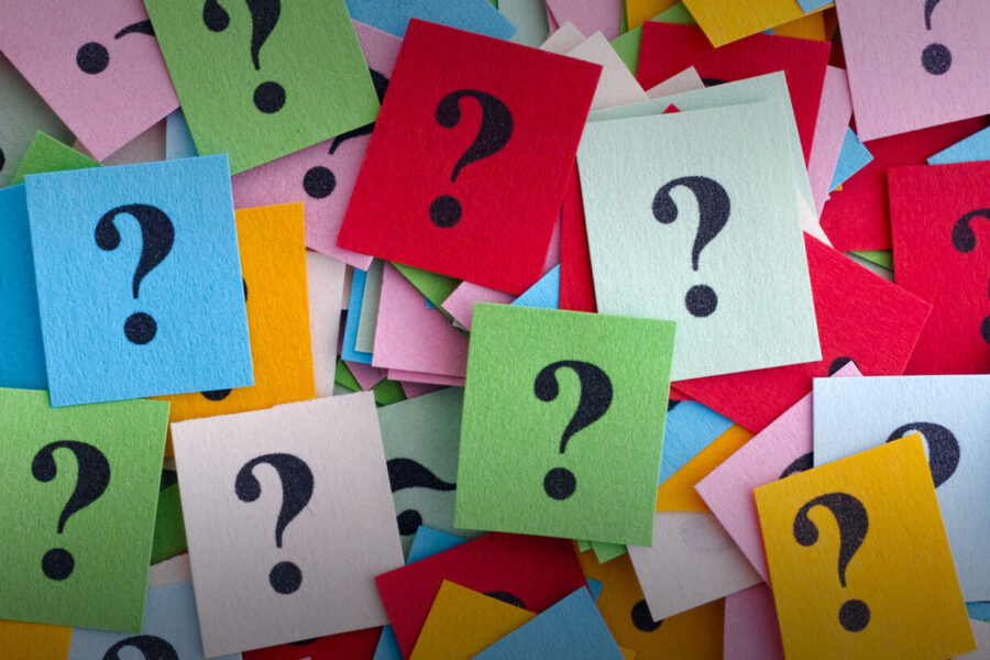 colorful squares of paper with a ? mark