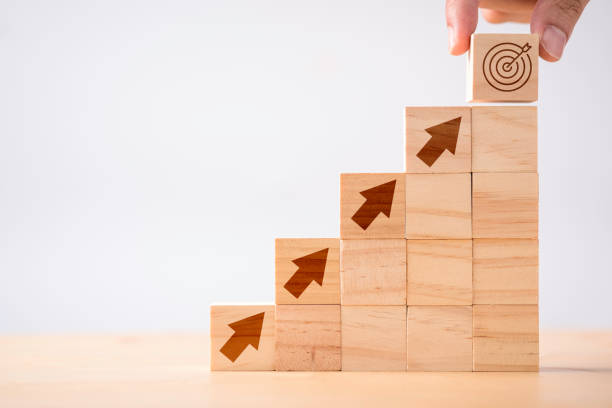 building blocks with arrows on steps up
