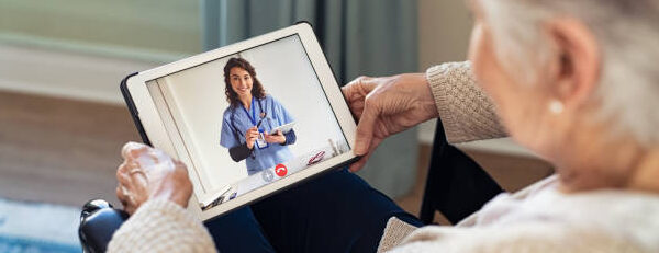 elderly woman virtual visit with doctor on a tablet
