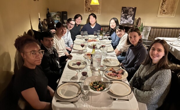Hong lab members with visiting scholars all around a fine restaurant table