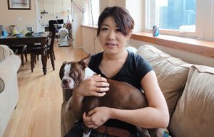 headshot of Eri Iwasaka with her dog