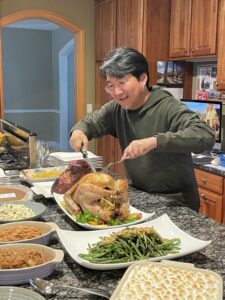 Dr Hong carving a turkey