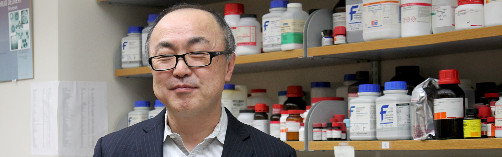 Professor Glen Kwon standing in his laboratory
