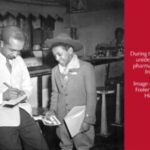 1944 black male pharmacist buying war bonds from a black boy scout.