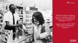 1971 pharmacist Ben Armstrong serving a customer in Grand Rapids MI