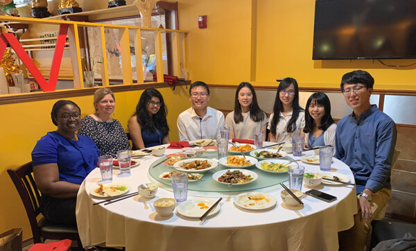 Shiyanbola Research members celebrating with dinner together