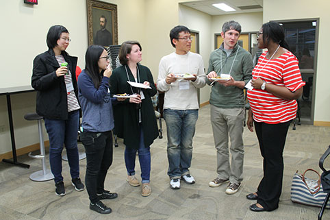 Dr. Shiyanbola conversing with students