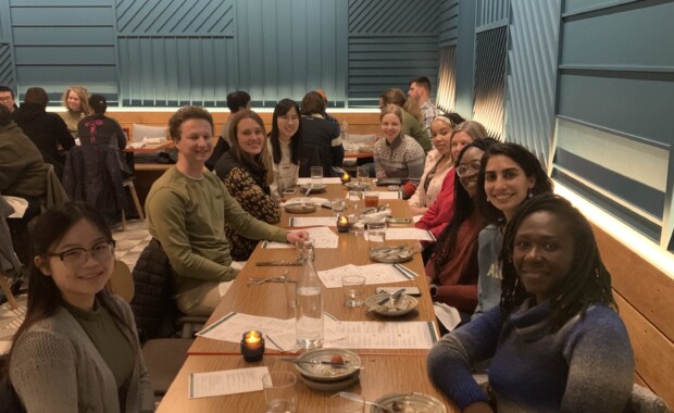 Shiyanbola Research members sitting down at a restaurant together