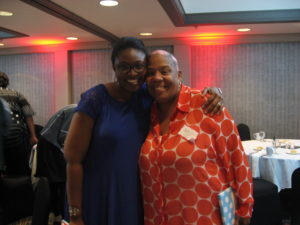 Prof. Shiyanbola arm in arm with a participant in her "African Americans’ Perception of Type II Diabetes" study