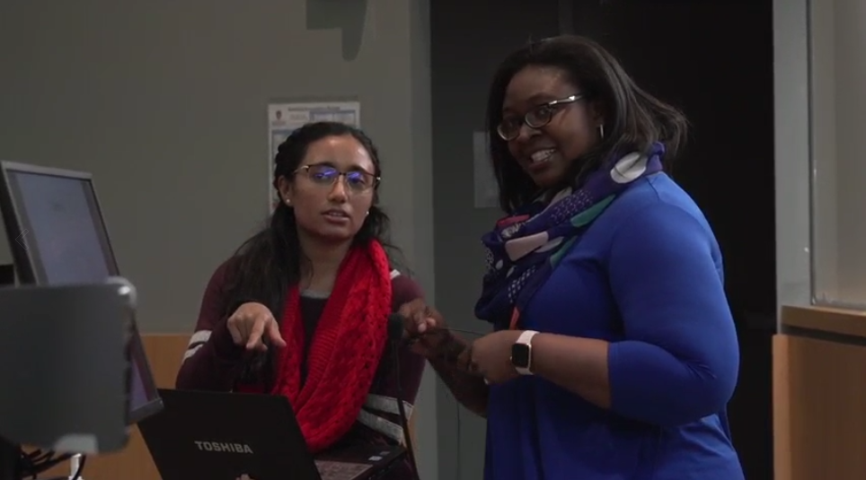 Dr. Shiyanbola with female student in classroom