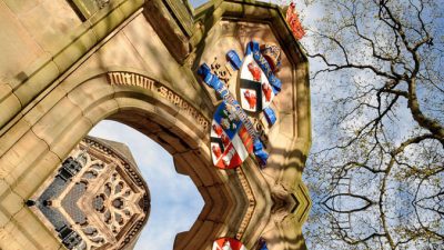 Upward shot of gate with University of Aberdeen crest