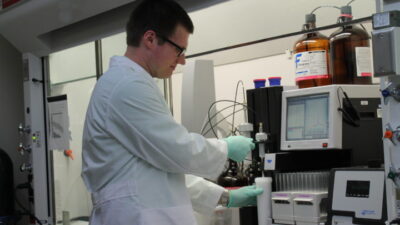 Male student working in a pharmaceutical lab