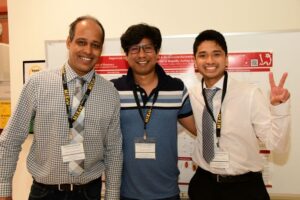 Wenthur Lab members posing in front of their research for the MIKIW conference