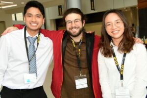 Matthew Enriquez, Nate Jones, and another Wenthur Lab member wearing MIKIW name tags for the conference