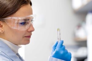 Closeup of woman looking at a crystal