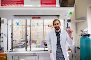Cody in front of a hood in his lab
