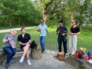 Wenthur lab members drinking and eating snacks at picnic point