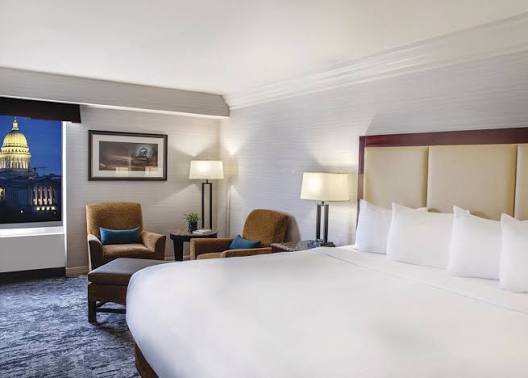 spacious room in the Concourse Hotel with view of the State Capitol building out the window