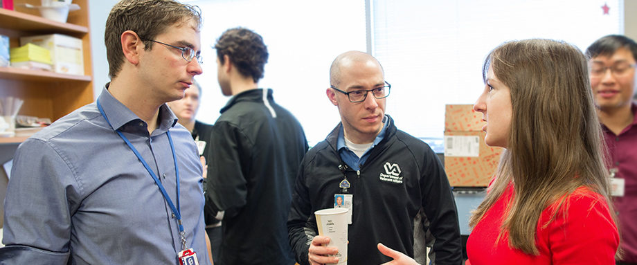 Pharmacists discuss a project in a clinical office