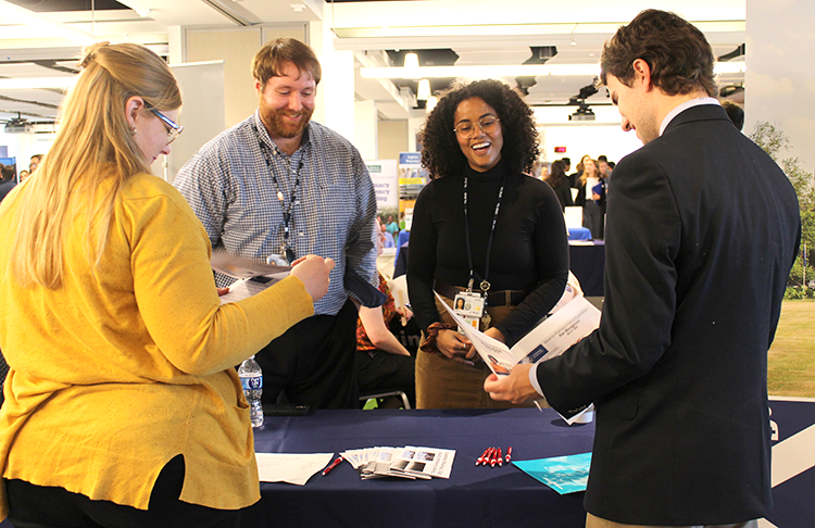 PharmD students chat with representatives at the annual career fair