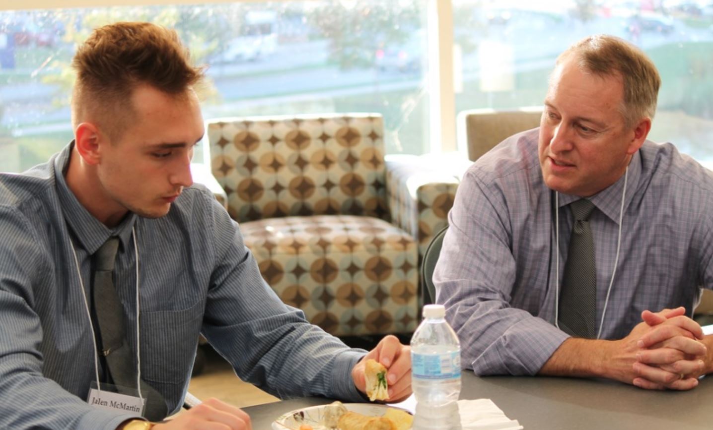 Pharmacy student Jaden sits down to chat with a mentor as part of the Leadership Path of Distinction