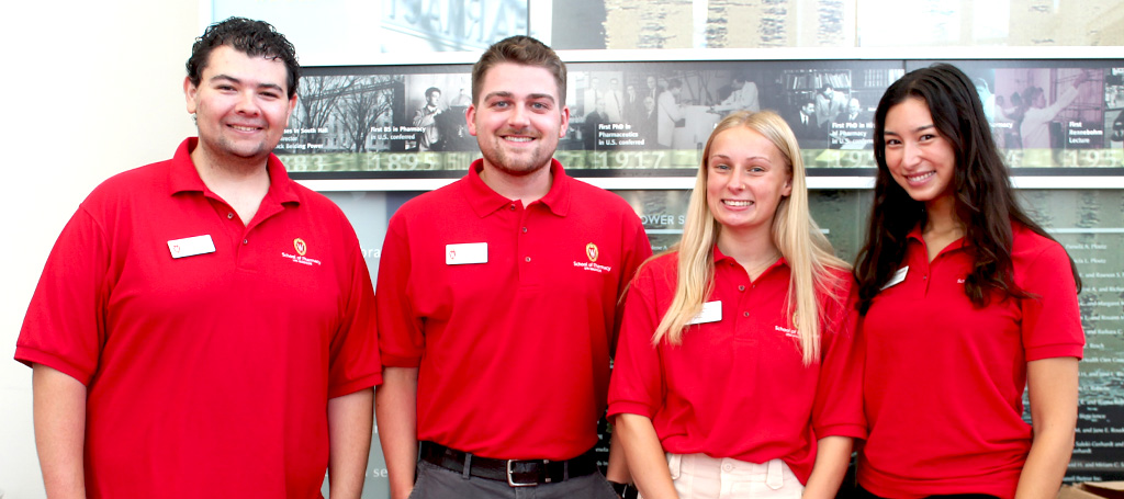 PharmD student ambassadors working at fall orientation pose together for a photo
