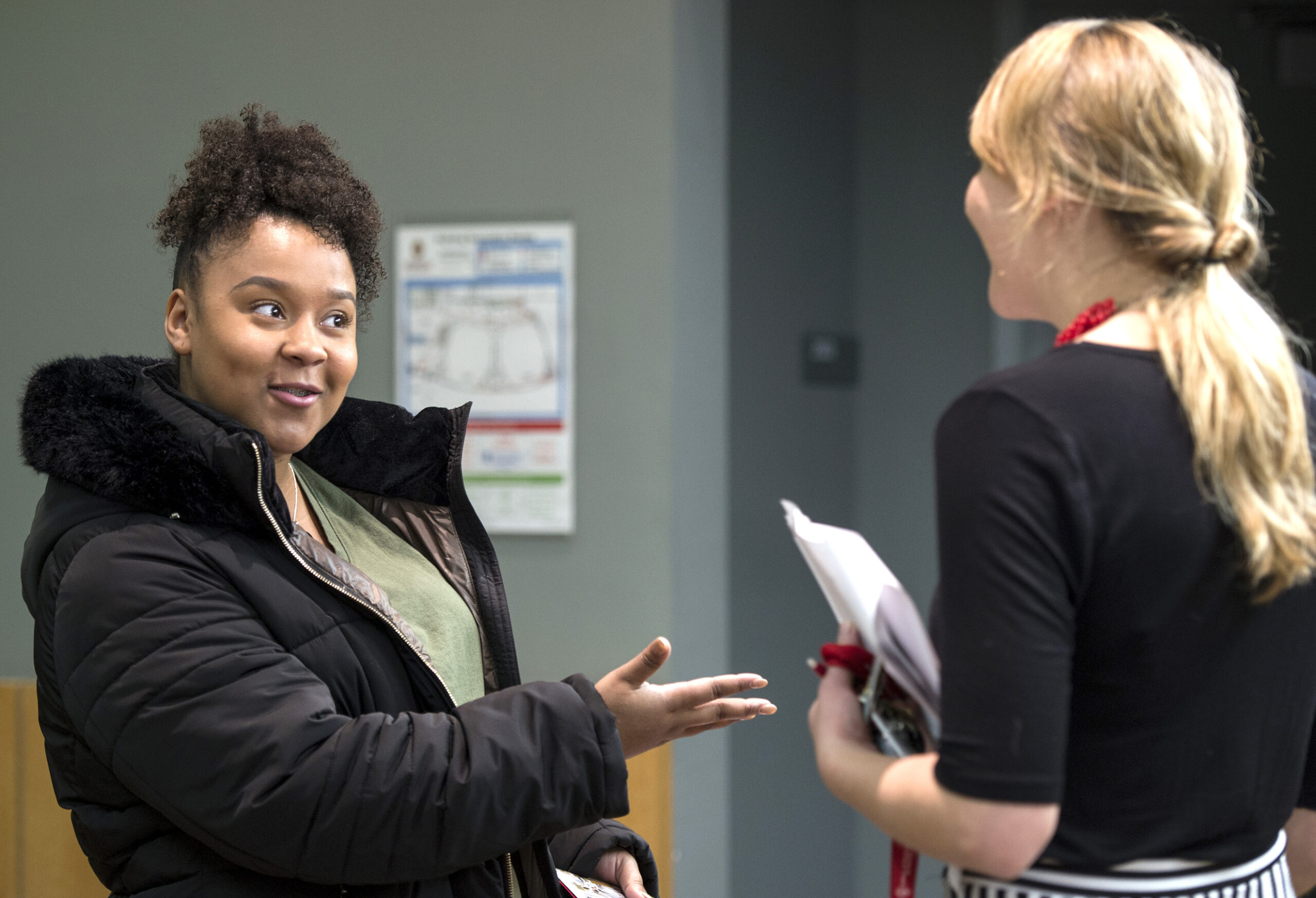 A prospective student chats with Admissions Advisor Janelle at an Open House event