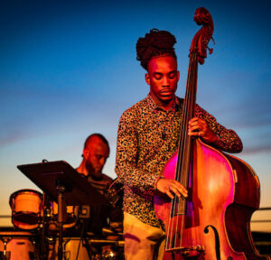 Members of the Madison community enjoy a warm summer evening and the sounds of trumpeter Marquis Hill and his band at a Madison Jazz Festival event held at the Memorial Union Terrace at the University of Wisconsin-Madison on June 19, 2021. (Photo by Bryce Richter / UW-Madison)