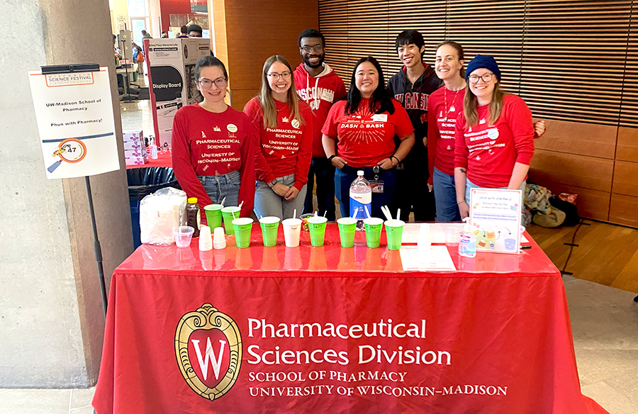 Pharmsci grad students pose together at their 2025 Science Festival booth