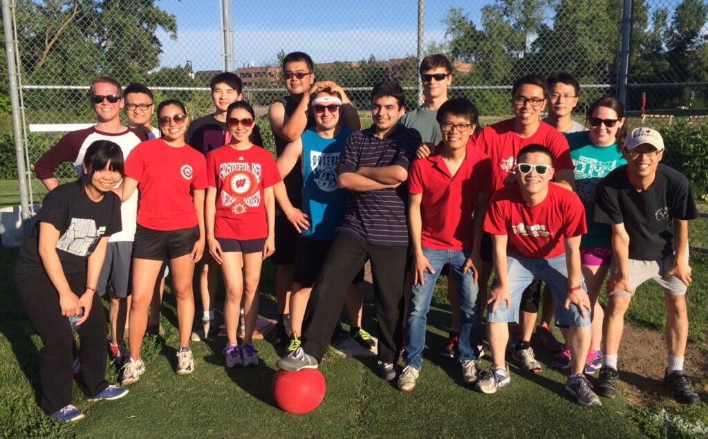 Fun-loving AAPS members pose together at the start of a kickball match