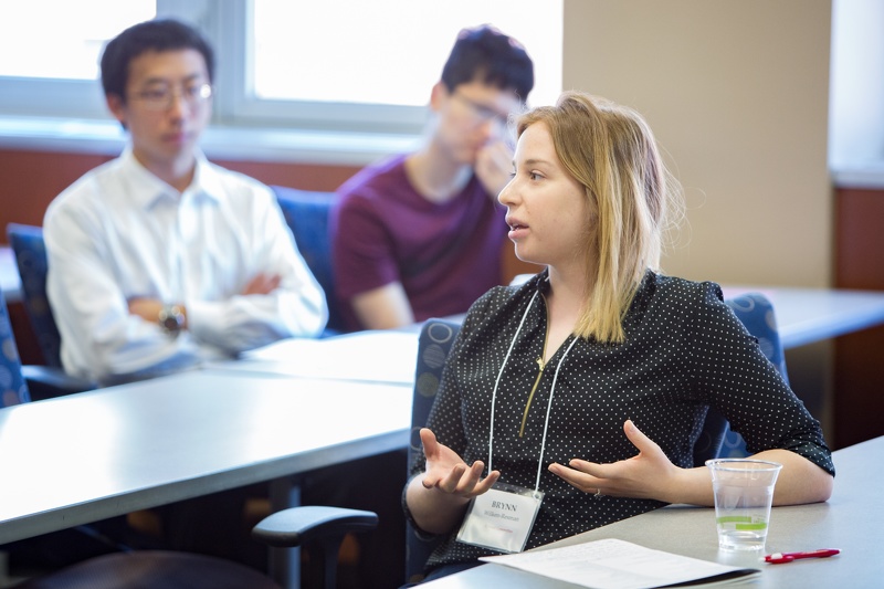 A Pharmsci grad student shares her thoughts in a meeting with other students. Photo by Todd Brown, Media Solutions