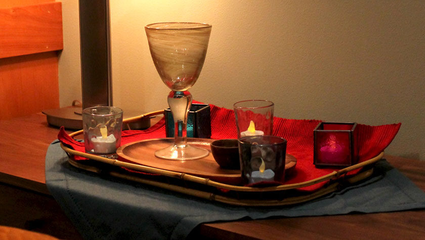 A tray of beautiful glass candle holders