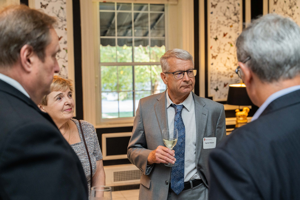 Evgenyi Shalaev and his partner speak with Steve Swanson and others.