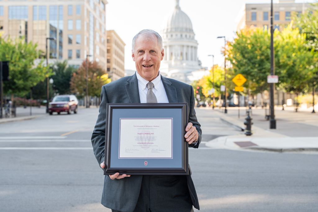 Eugene McNally poses with his award