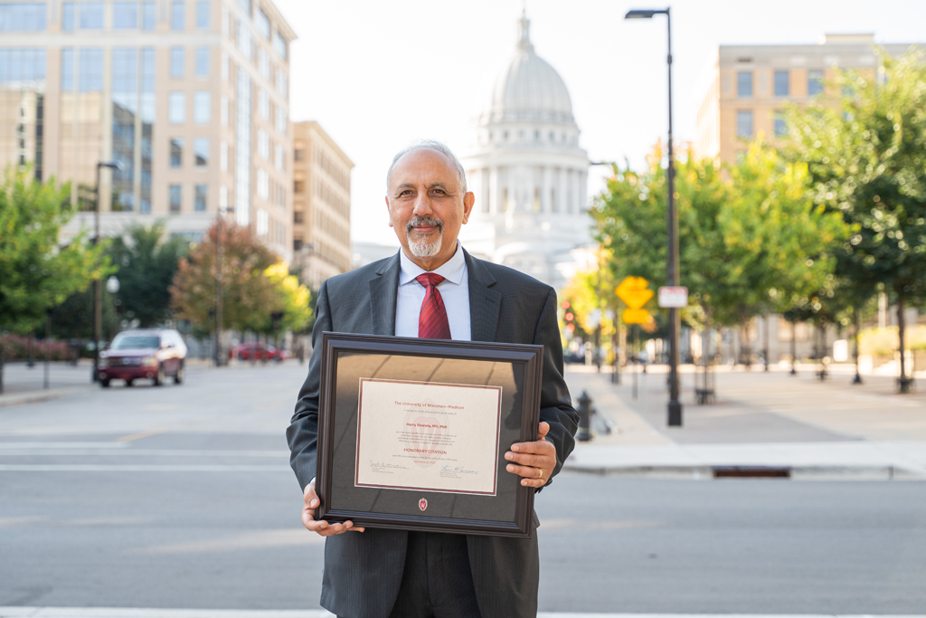 Harry Sharata poses with his award
