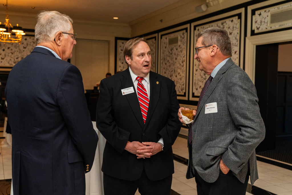 A surprised Steve Swanson speaks with Steve Skolaski.