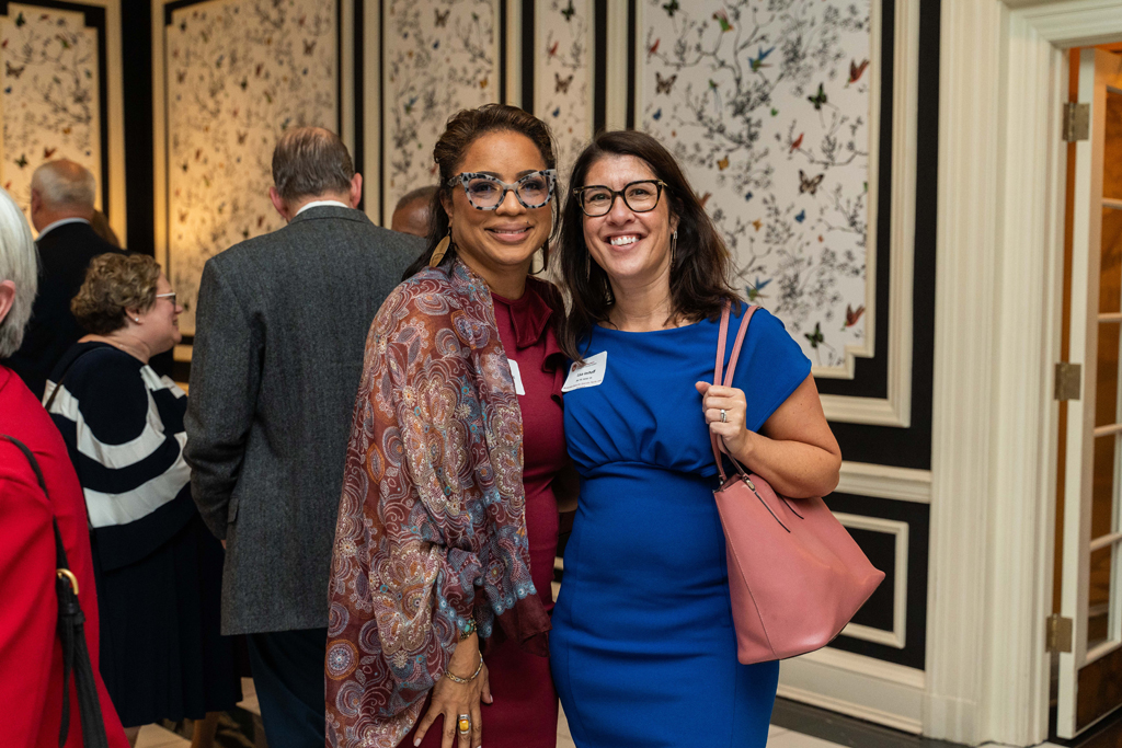 Yolanda Tolson and Lisa Imhoff pose for a photo.