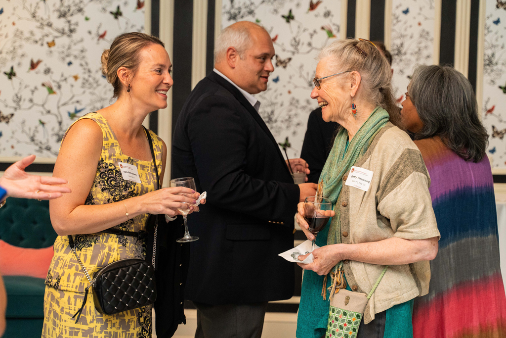 Betty Chewning and Kate Rotzenberg smile while they speak.